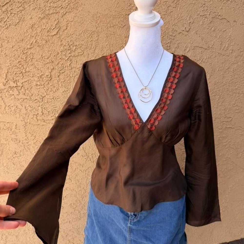 Brown silk blouse with orange floral embroidery and bell sleeves